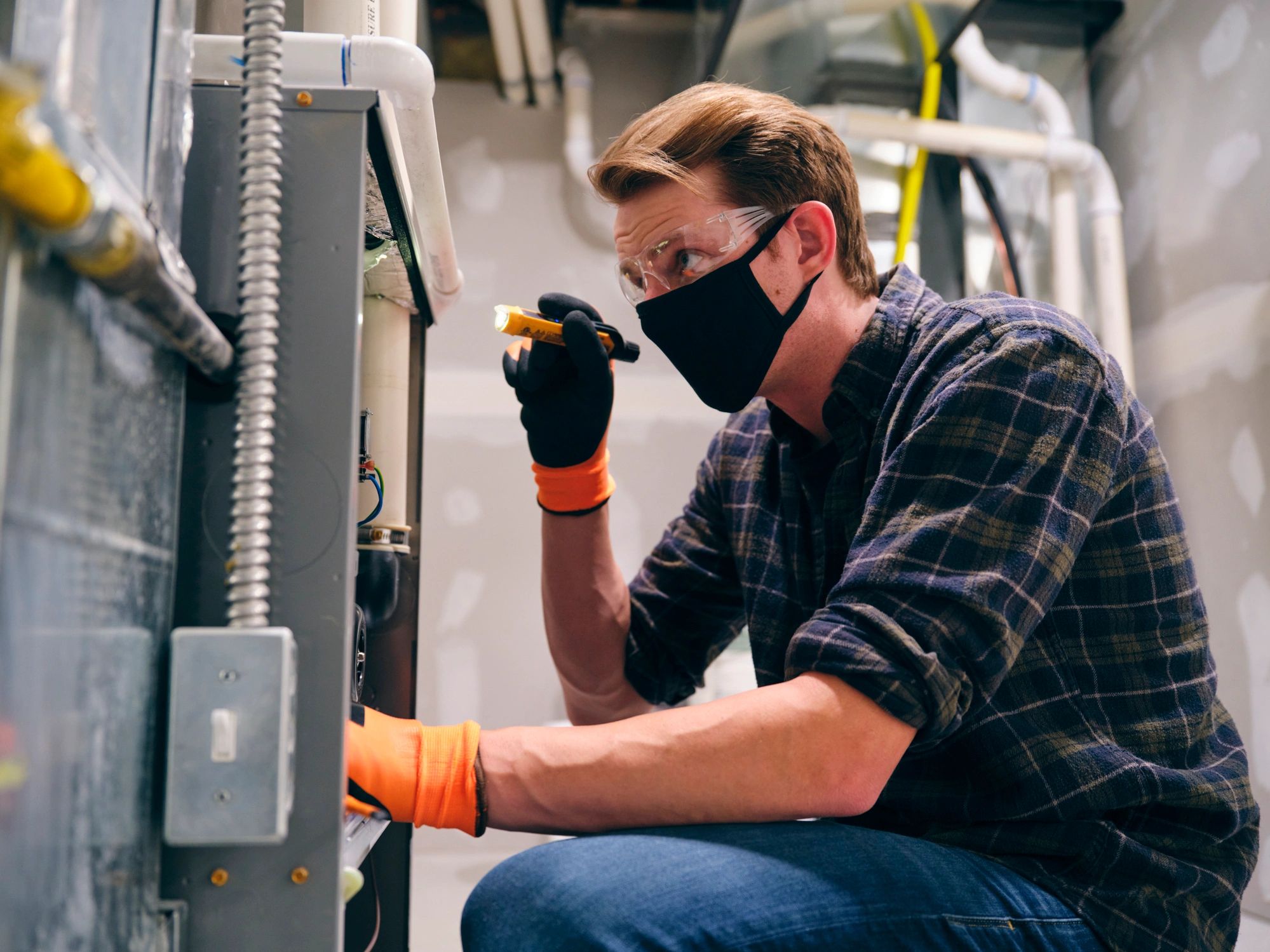 Technician inspecting an air filtration system