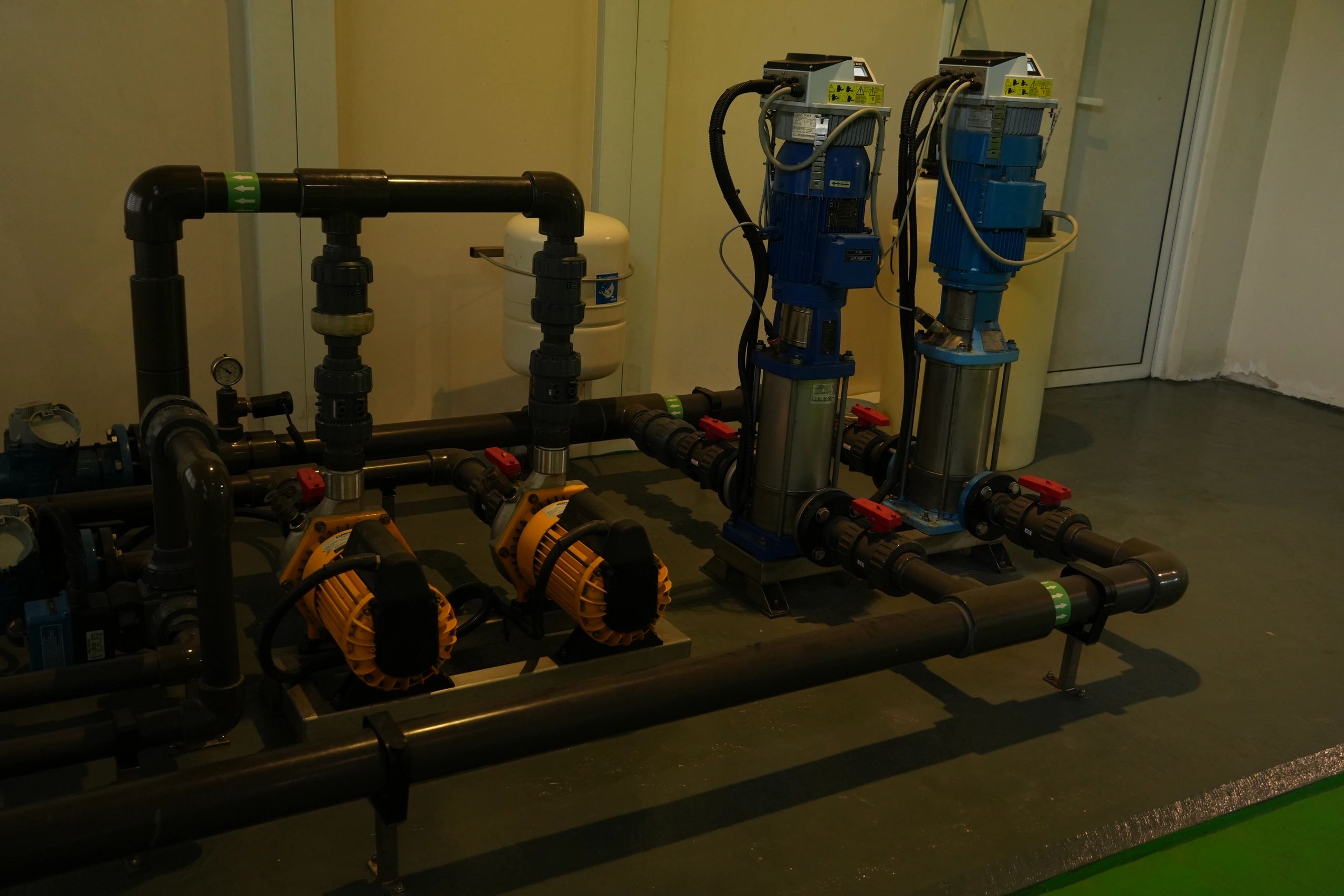 Industrial water pumping and piping system in a utility room